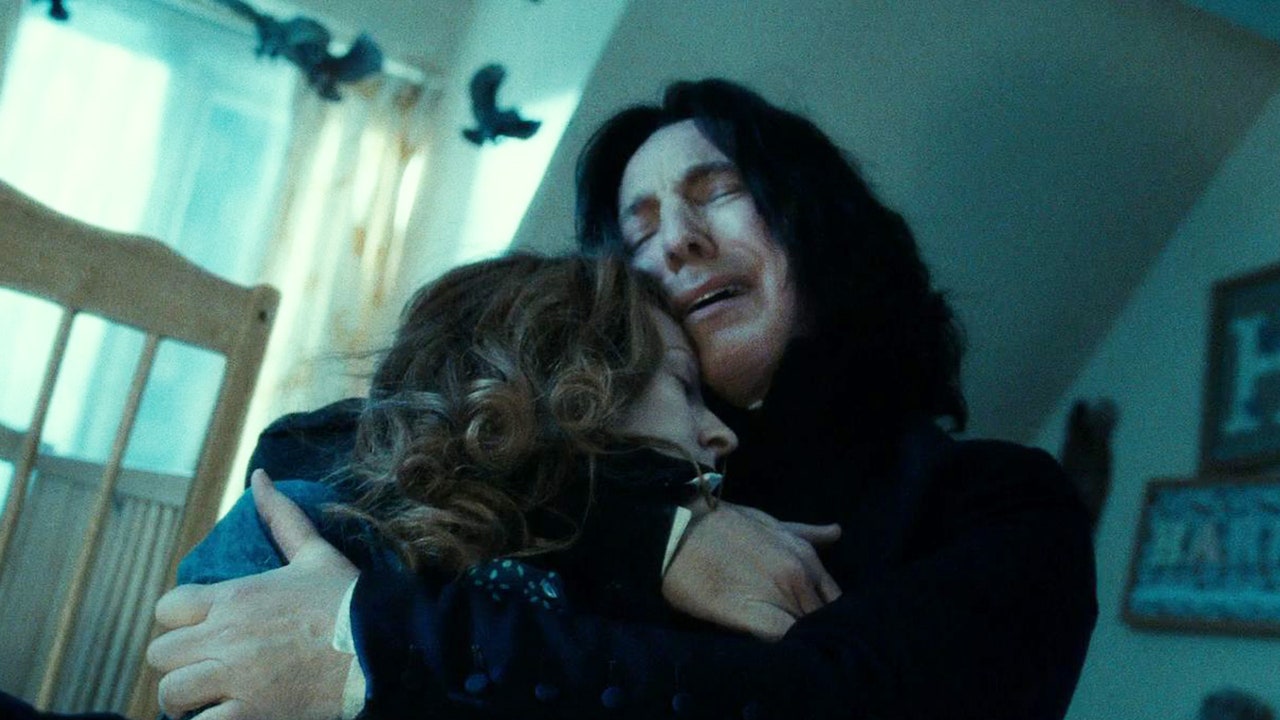 Severus Snape crying and holding Lily Potter's dead body.